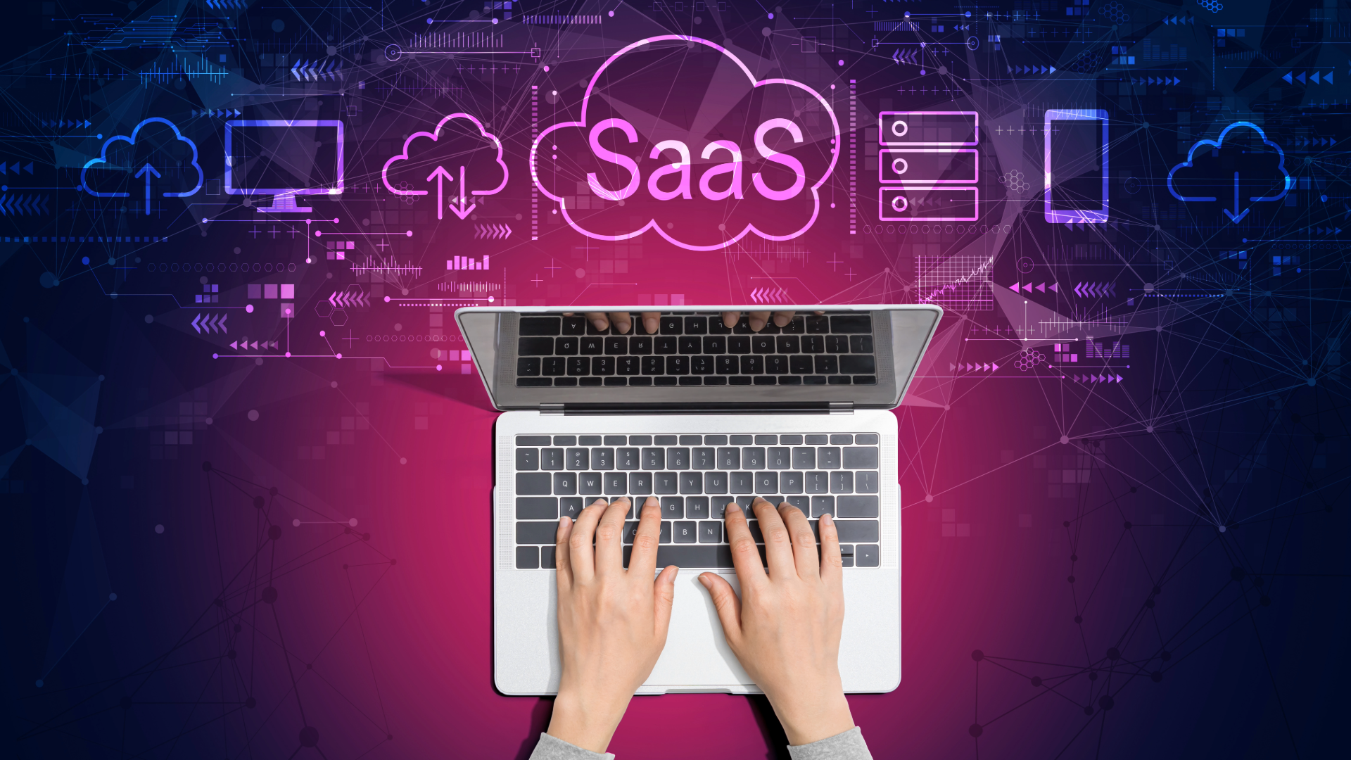 Laptop with 2 hands typing with technology clouds behind with the words SaaS